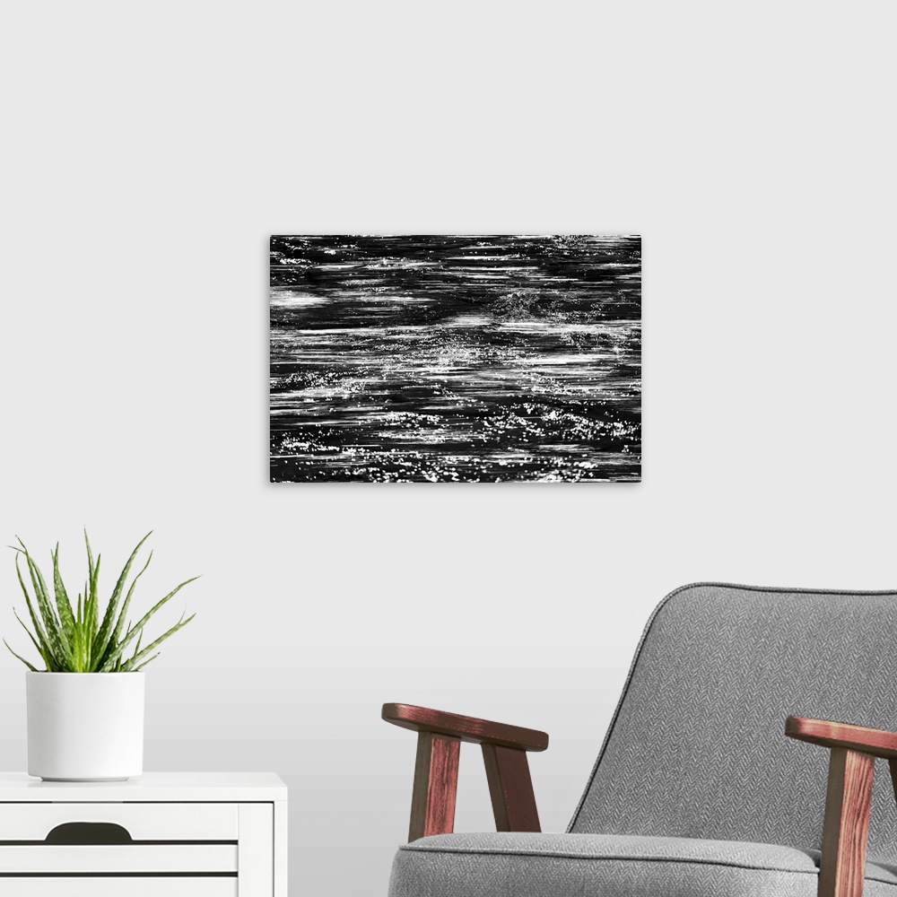 A modern room featuring Black and white abstract image of rushing water in a river.