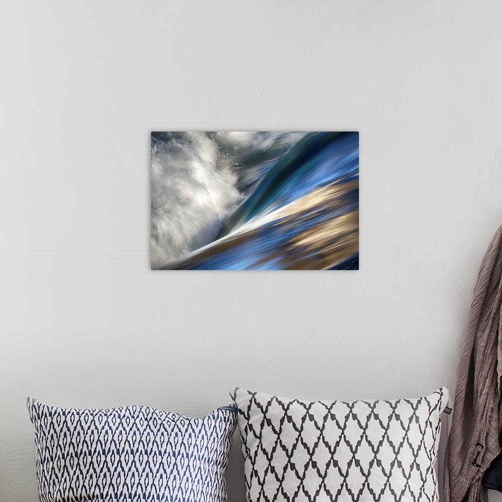 A bohemian room featuring Abstract photo of rushing water with color reflecting off the waves.