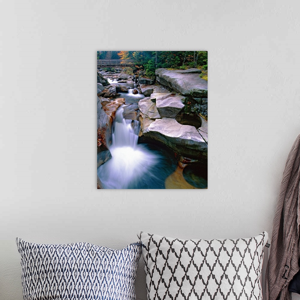 A bohemian room featuring Waterfall on the Ammonoosuc River near Mount Washington, New Hampshire (NH). A wooden bridge and ...