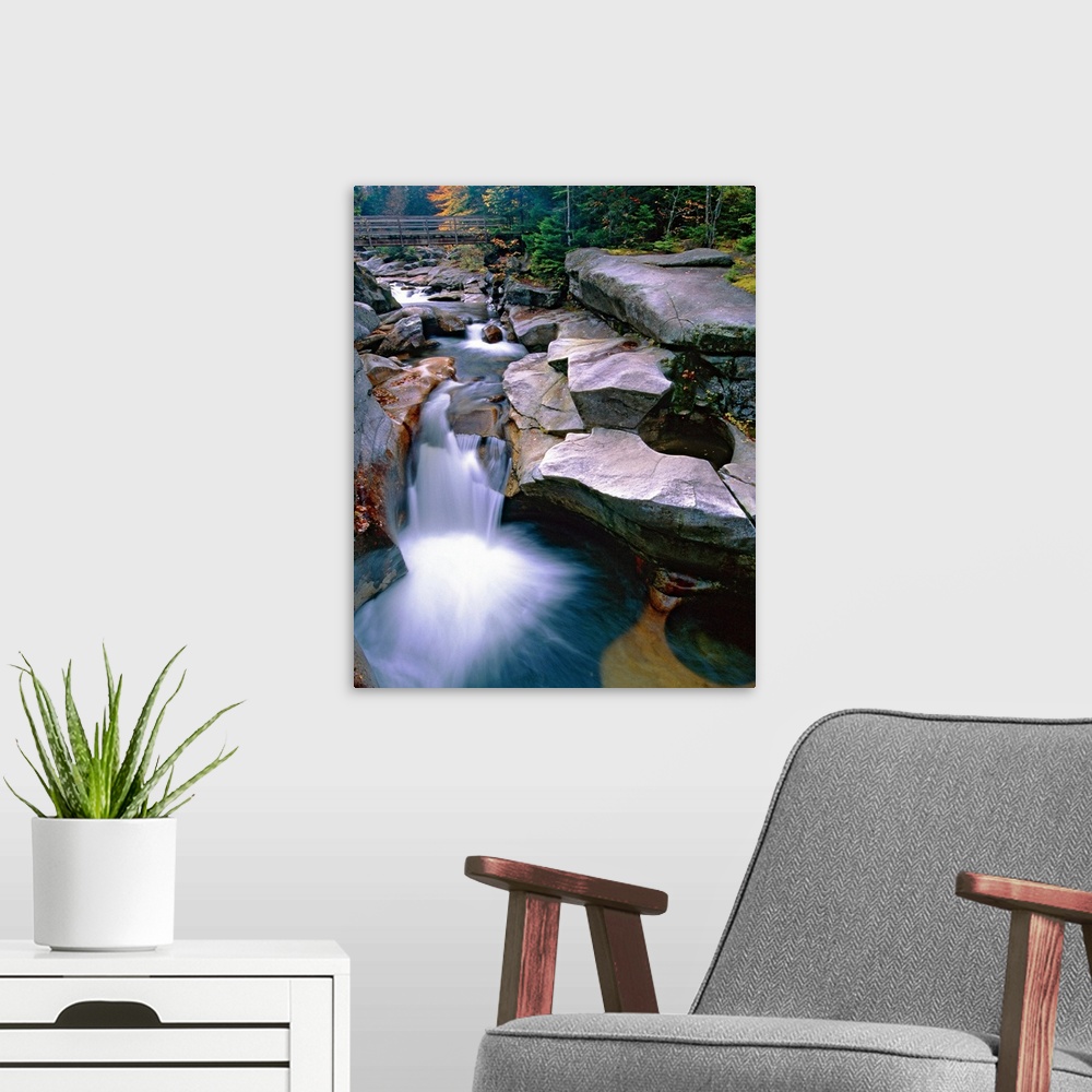 A modern room featuring Waterfall on the Ammonoosuc River near Mount Washington, New Hampshire (NH). A wooden bridge and ...