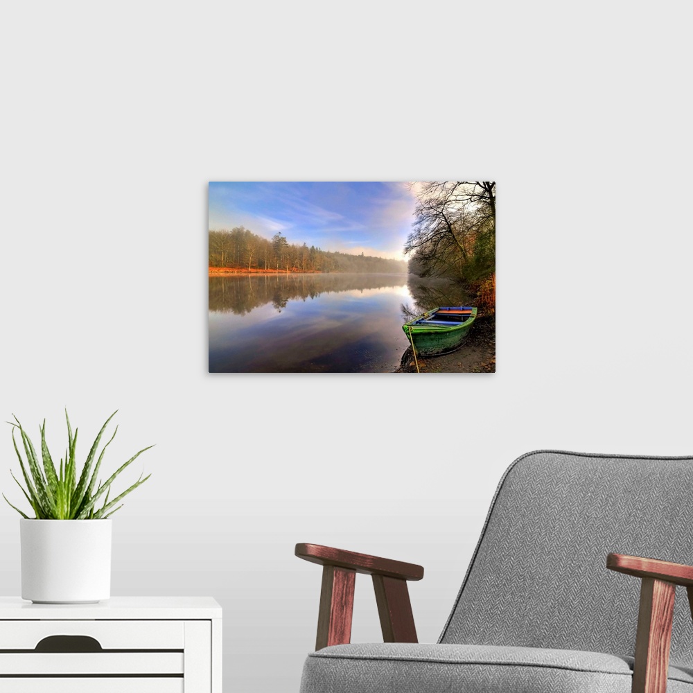 A modern room featuring Quite lake in the Broceliande forest with a colored boat on the side in France, Broceliande fores...
