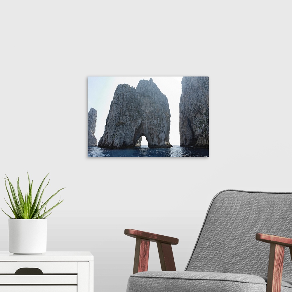 A modern room featuring Close up View of Rocks in the Sea, Faraglioni, Capri, Bay of Naples, Campania, Italy.