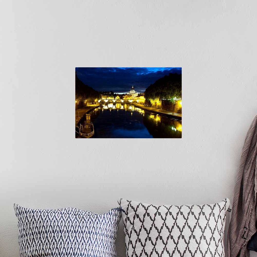 A bohemian room featuring Night view of the Tiber River with the Vatican City in the Background, Rome, Lazio, Italy.