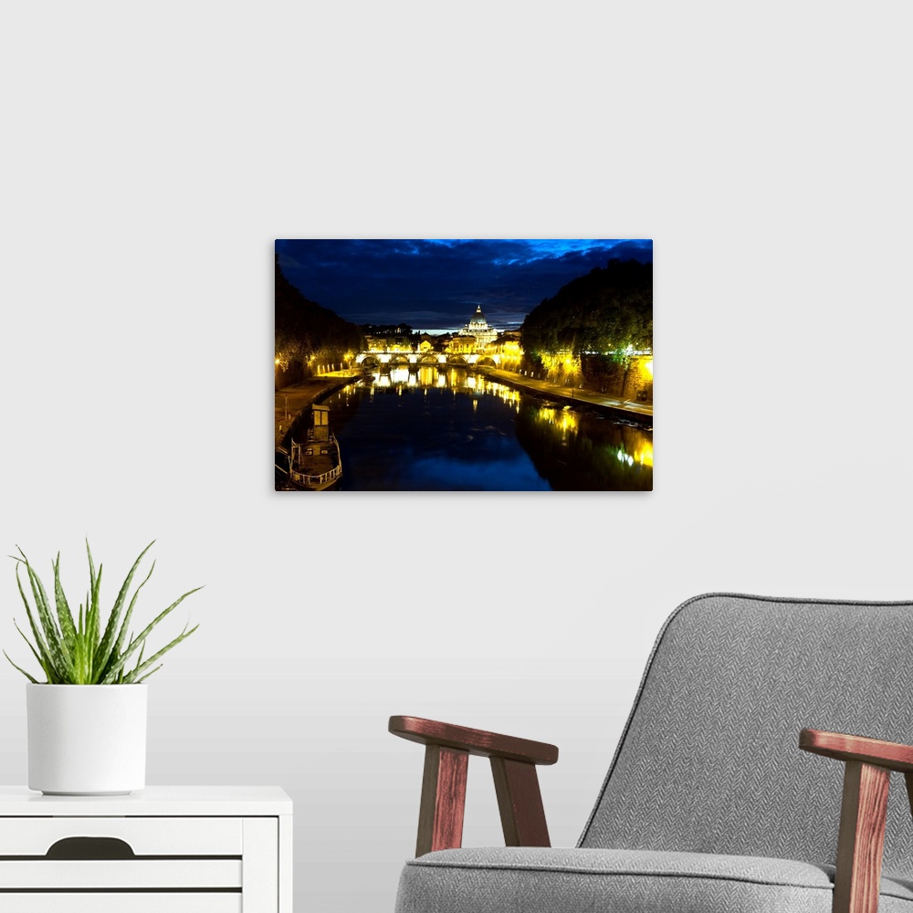 A modern room featuring Night view of the Tiber River with the Vatican City in the Background, Rome, Lazio, Italy.