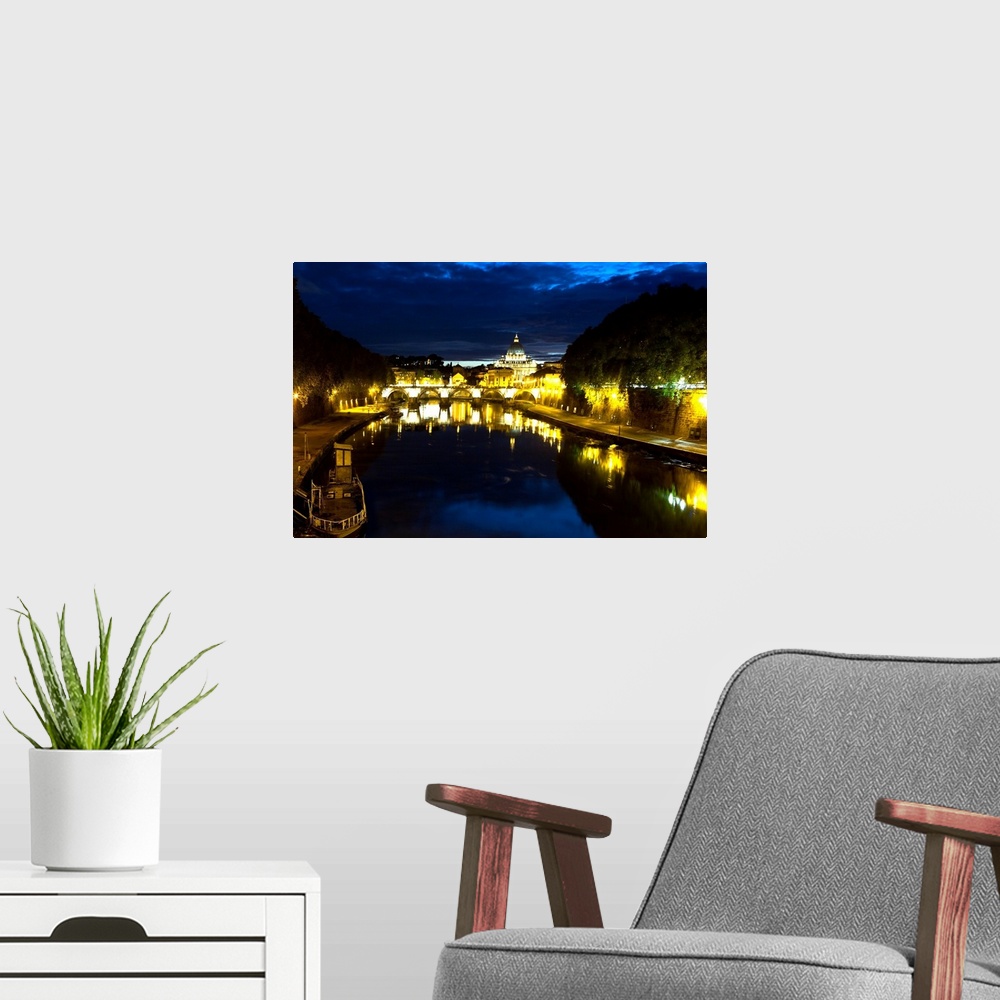 A modern room featuring Night view of the Tiber River with the Vatican City in the Background, Rome, Lazio, Italy.
