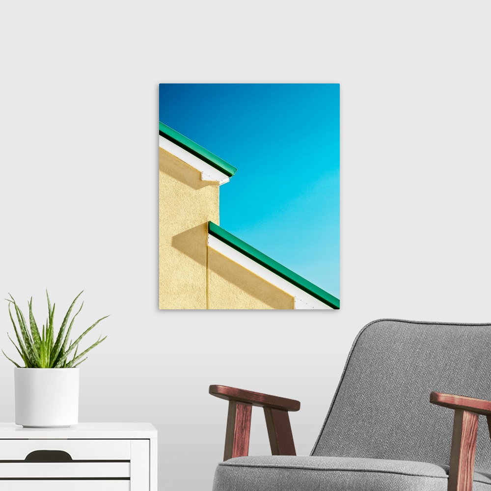 A modern room featuring Abstract view of the green roof of a house against a blue sky.