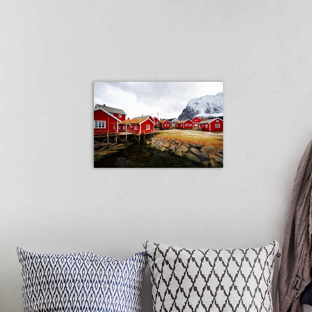 A bohemian room featuring A photograph of a red building village in a mountain landscape.