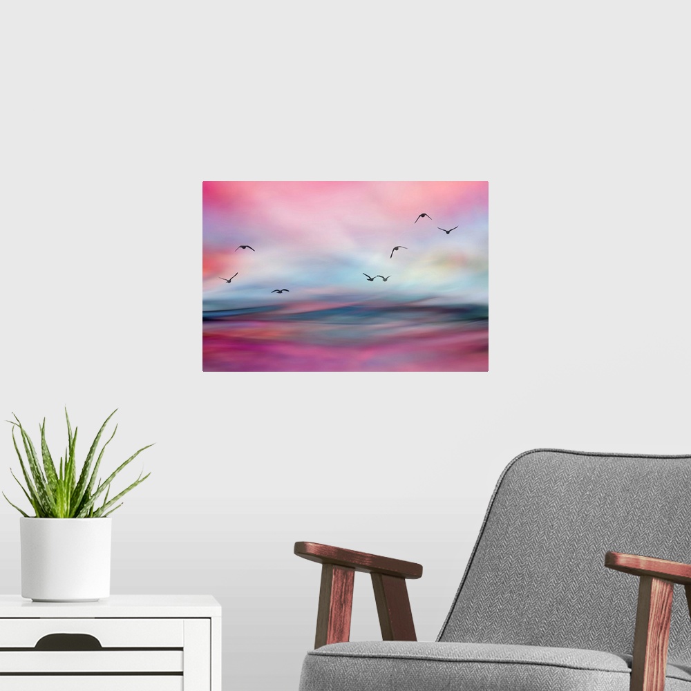 A modern room featuring Birds flying over morning water.