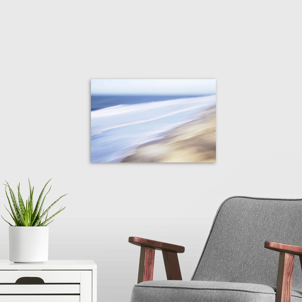 A modern room featuring Artistically blurred photo. A wild sea running to the shore on a windy summer day.