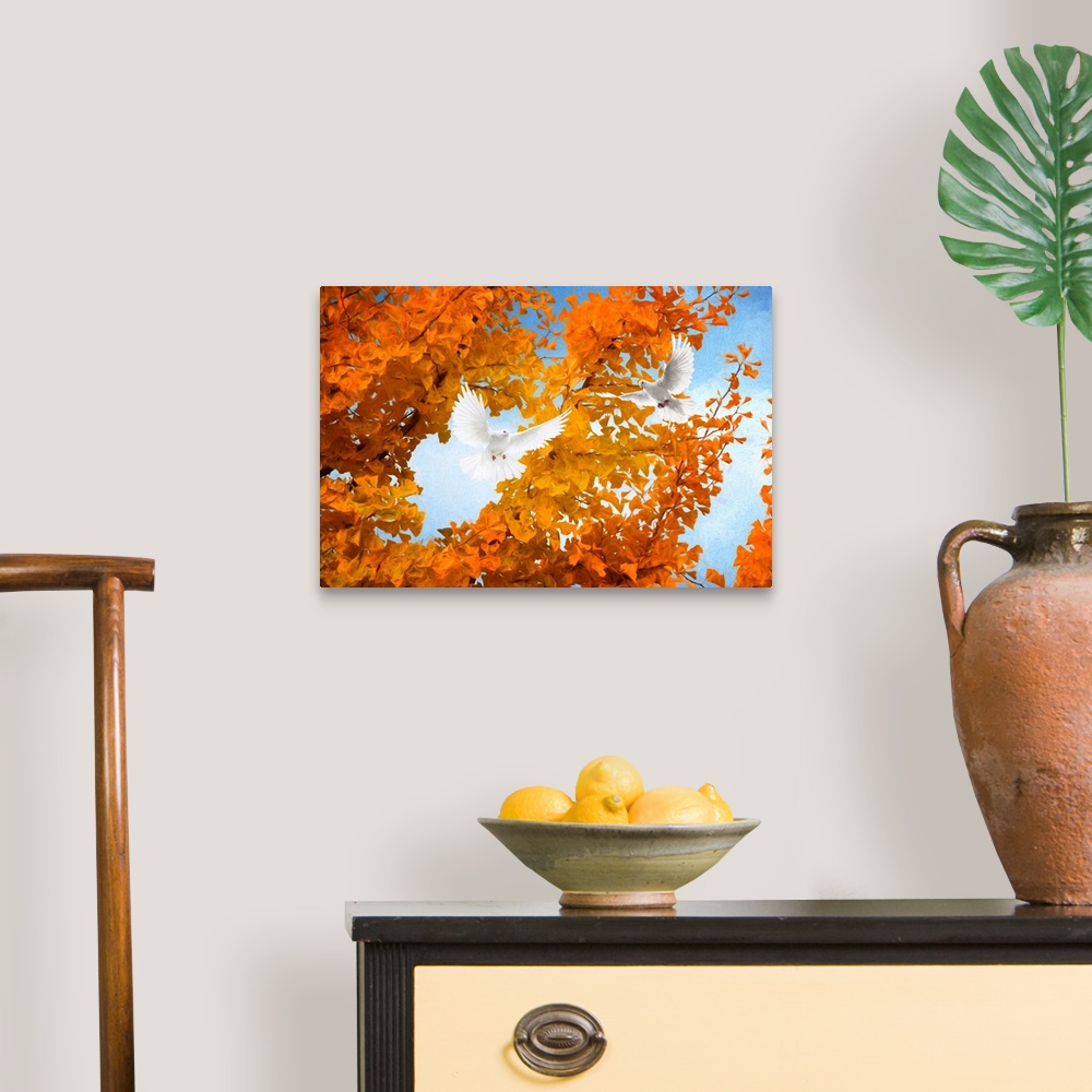 A traditional room featuring Fine art photograph of two white doves flying in front of a tree with bright orange leaves.