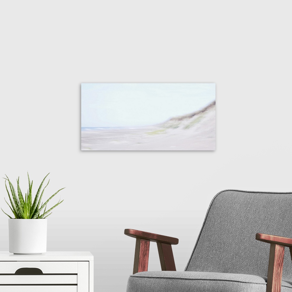 A modern room featuring Artistically blurred photo. Waves come to rest on the beach in the safe embrace of the dunes.