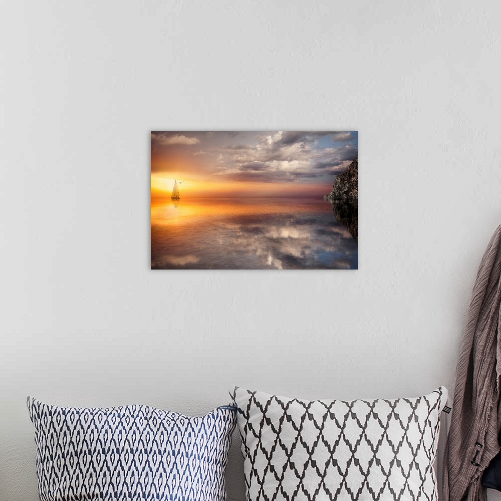 A bohemian room featuring Photograph of sailboat on ocean with sun and clouds reflection.  There is a silhouette of a bird ...