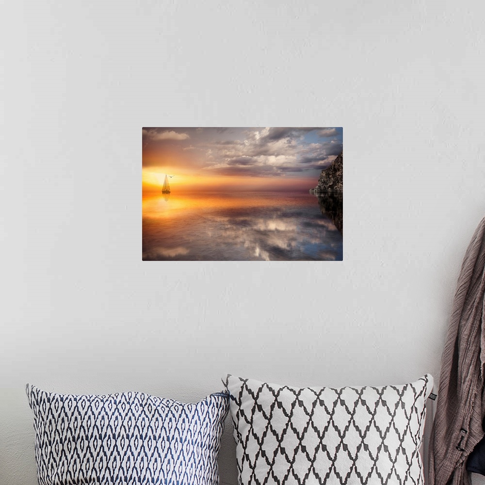 A bohemian room featuring Photograph of sailboat on ocean with sun and clouds reflection.  There is a silhouette of a bird ...