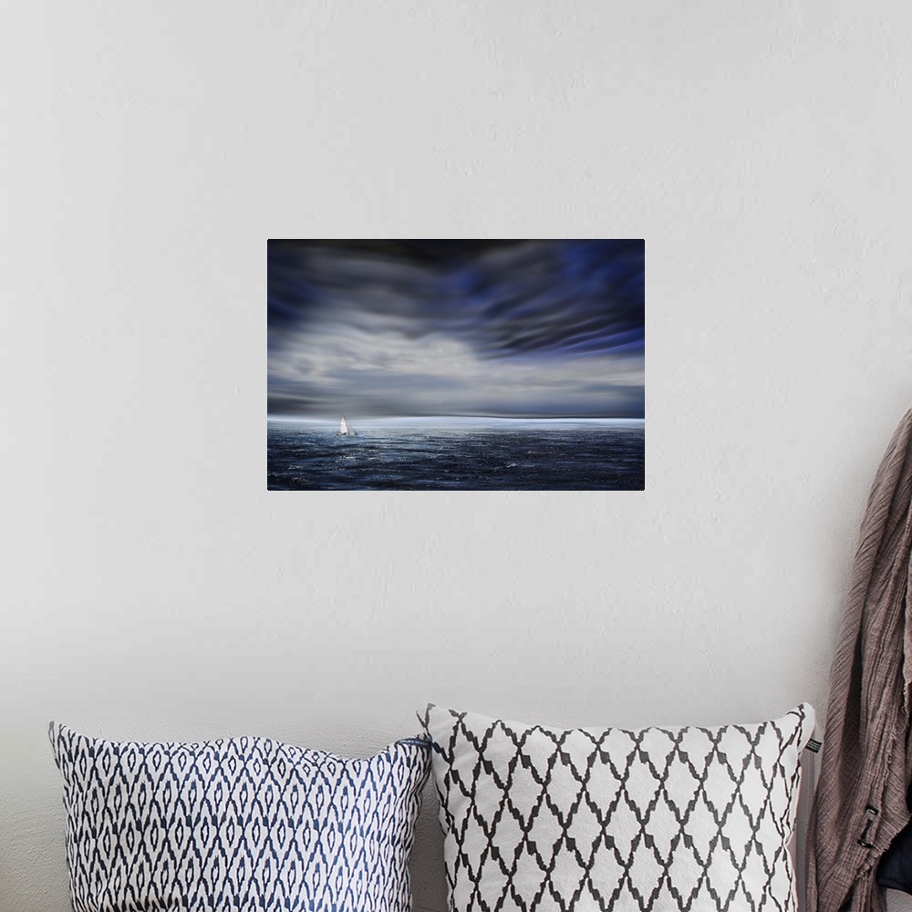 A bohemian room featuring A small sailboat dwarfed by the vastness of the open ocean, under dark stormclouds.