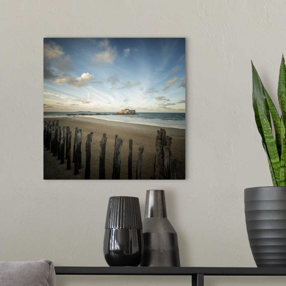 A modern room featuring Saint Malo in Brittany, France. Fort national under a dancing blue sky on a square picture.
