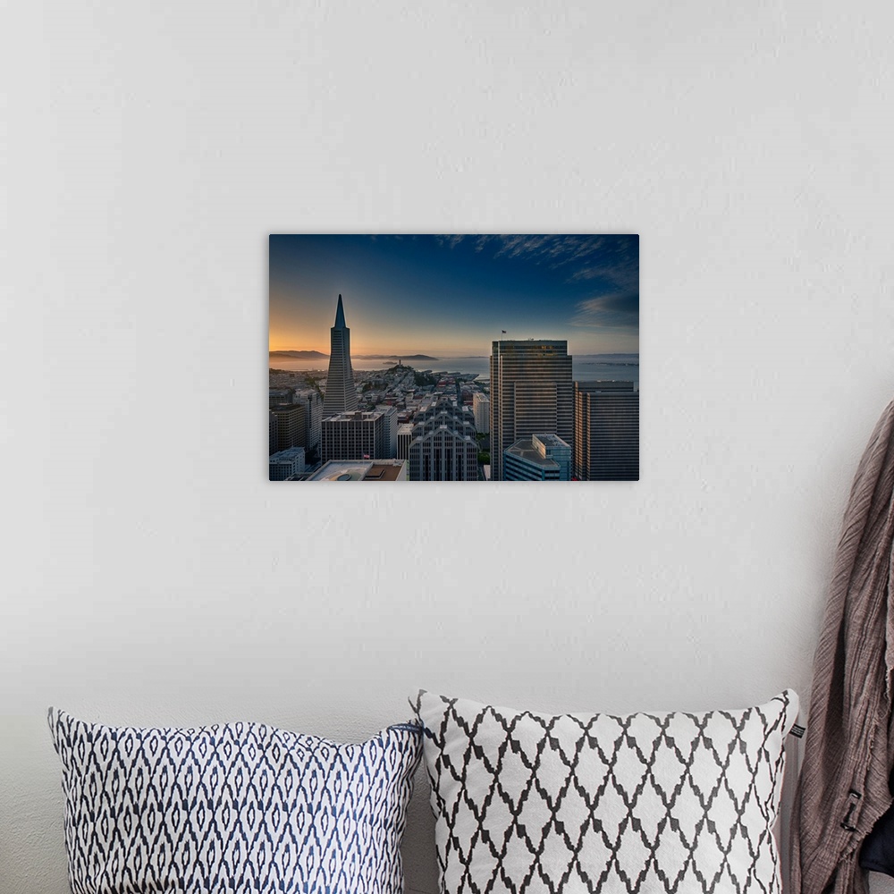 A bohemian room featuring San Francisco Bay view and skyline during sunset seen from Marriott Hotel.