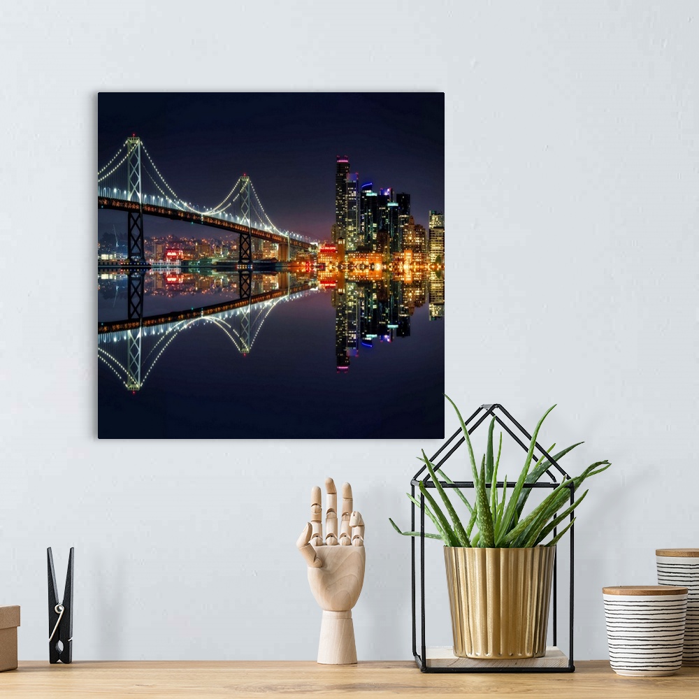 A bohemian room featuring Square photograph of the Bay Bridge and downtown San Francisco lit up at night and reflecting ont...