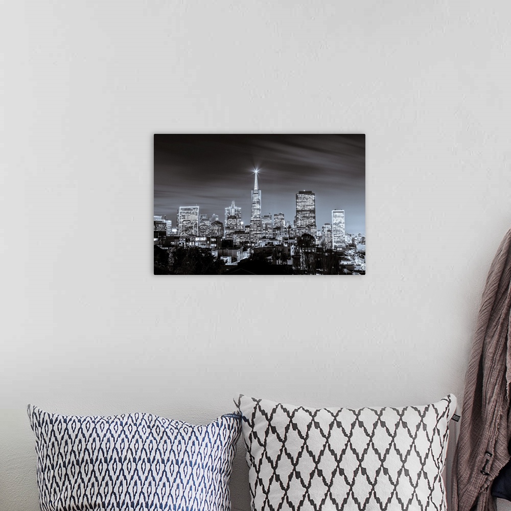 A bohemian room featuring A black and white long exposure image of the skyline of financial district in San Francisco.