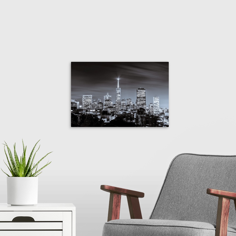 A modern room featuring A black and white long exposure image of the skyline of financial district in San Francisco.