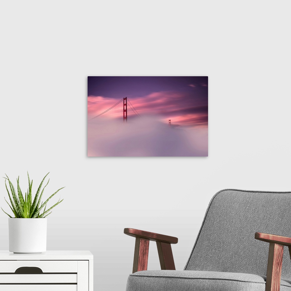 A modern room featuring A sunset obscured by dense fog and the Golden Gate Bridge rising out of the mist in this landscap...