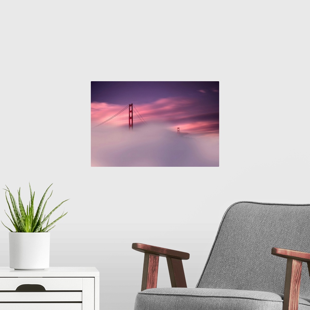 A modern room featuring A sunset obscured by dense fog and the Golden Gate Bridge rising out of the mist in this landscap...