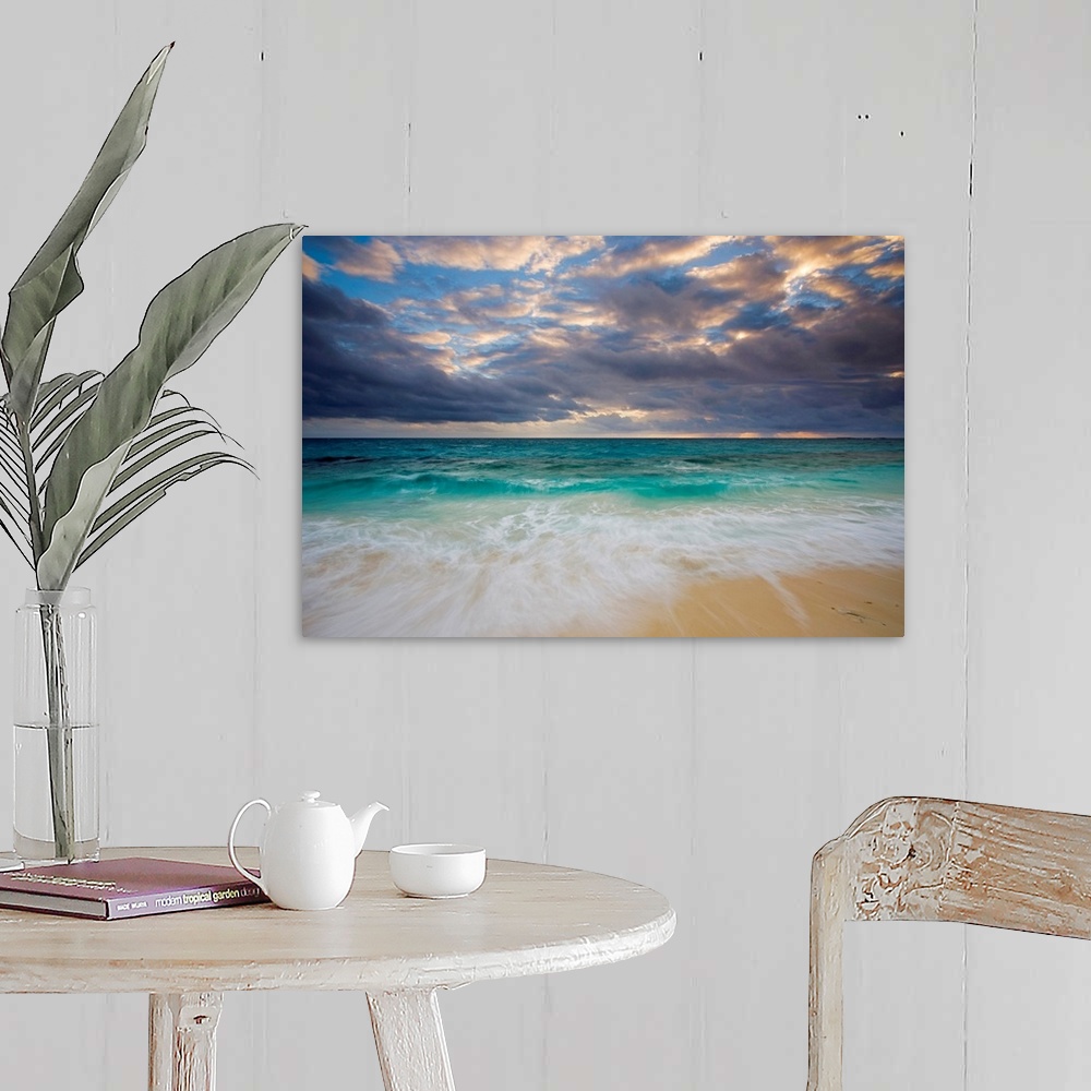A farmhouse room featuring A giant photograph of a beach on the Ambergris Cay Island within the Turks and Caicos Islands.  T...