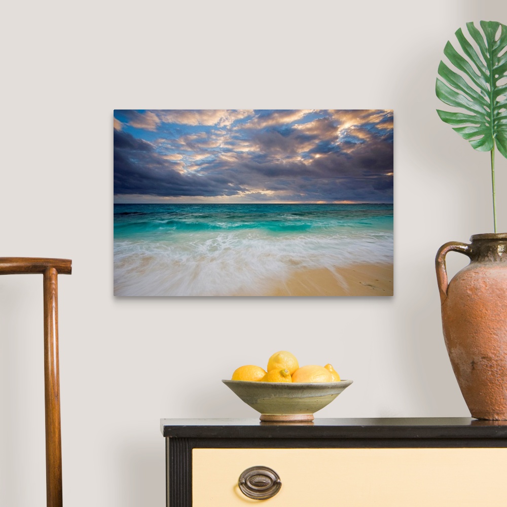 A traditional room featuring A giant photograph of a beach on the Ambergris Cay Island within the Turks and Caicos Islands.  T...