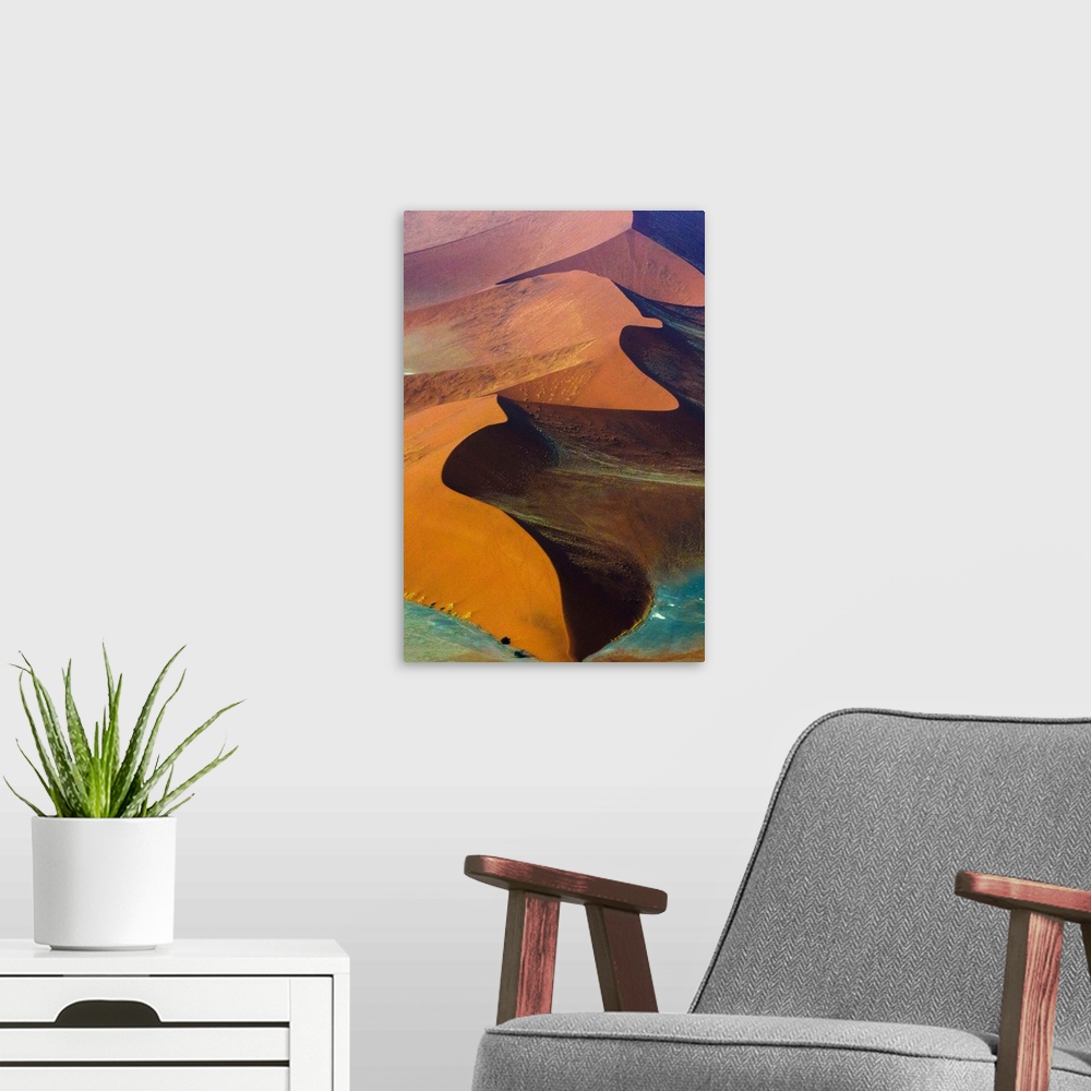 A modern room featuring Fine art photo of giant sand dunes of varying colors in Namib-Naukluft National Park, Namibia.