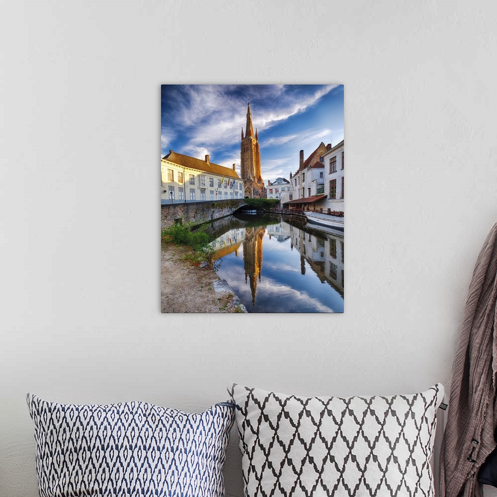 A bohemian room featuring Tranquil Scene in Bruges with the Church of Our Lady Reflected in the Canal, Bruges, Flanders, Be...