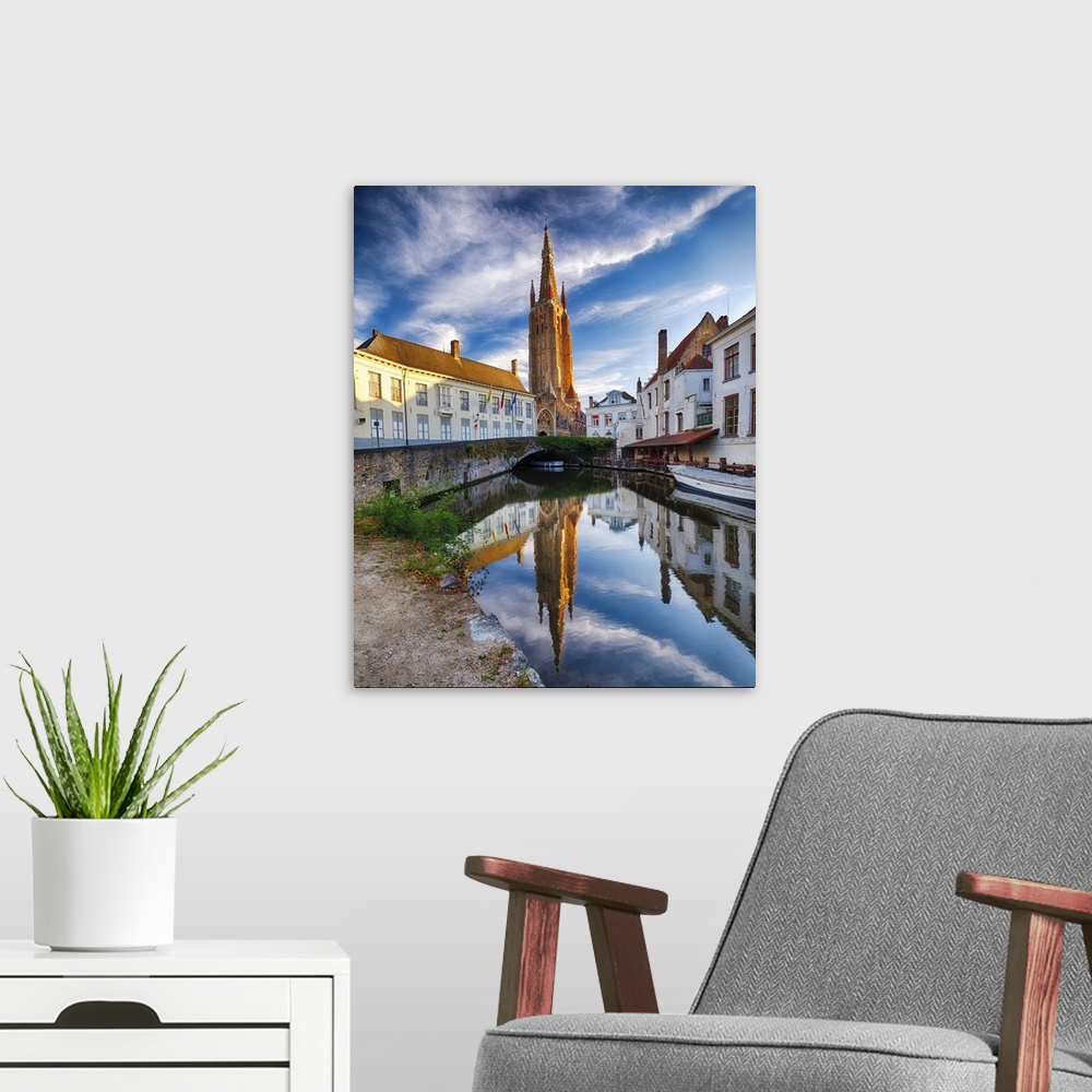 A modern room featuring Tranquil Scene in Bruges with the Church of Our Lady Reflected in the Canal, Bruges, Flanders, Be...