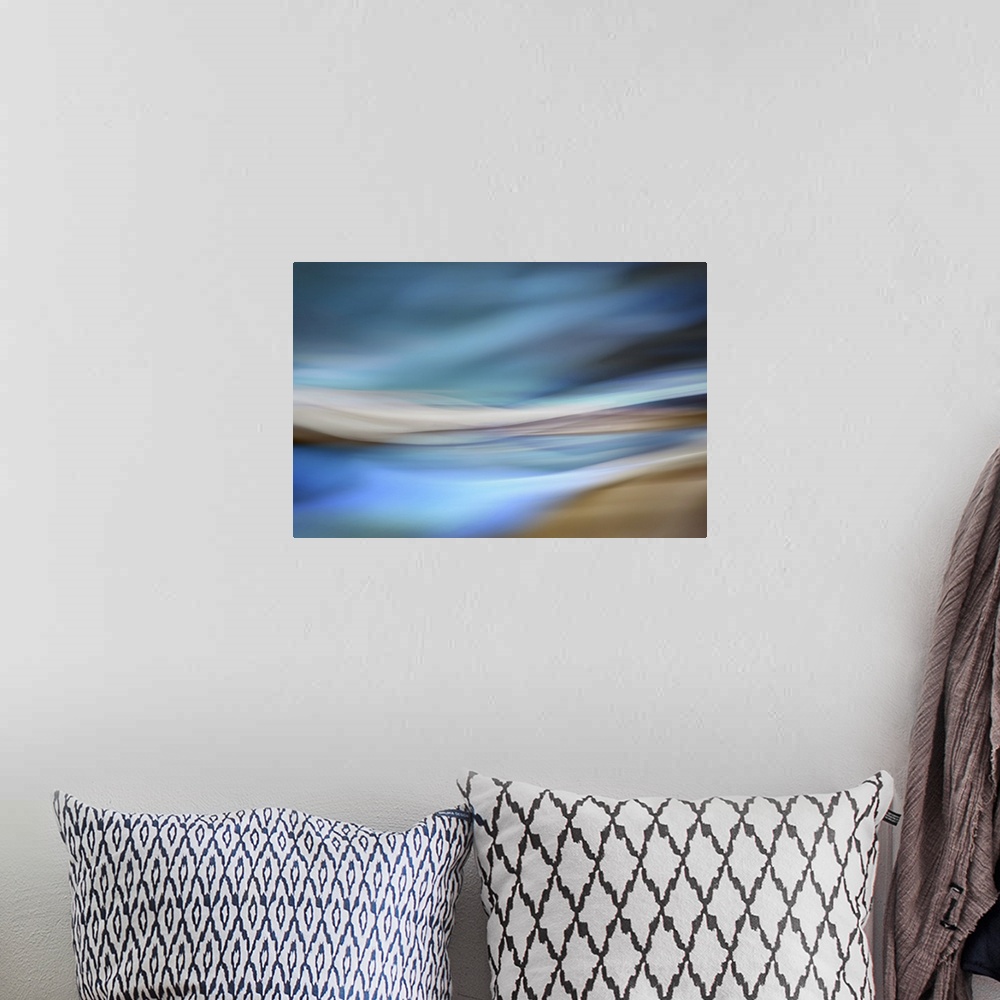 A bohemian room featuring Abstract interpretation of being on a sandy beach by the ocean, on a blue day.
