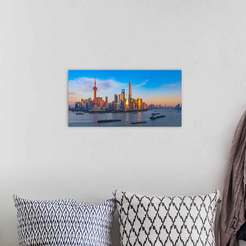 A bohemian room featuring Panoramic photograph of the city of Shanghai, China.