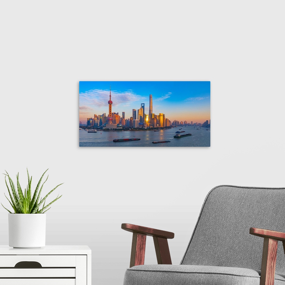 A modern room featuring Panoramic photograph of the city of Shanghai, China.