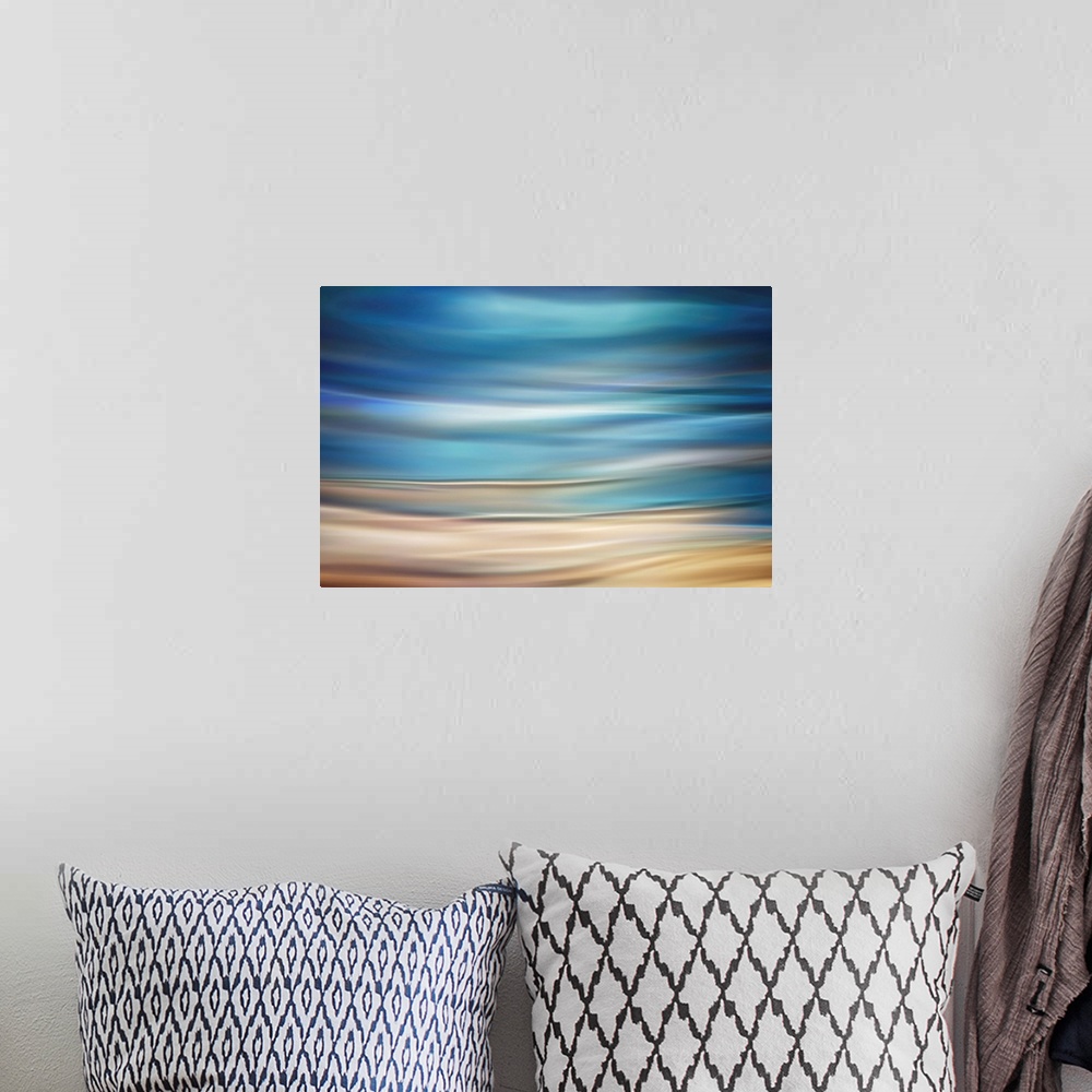 A bohemian room featuring Fine art photograph of abstract waves resembling a coastal landscape.