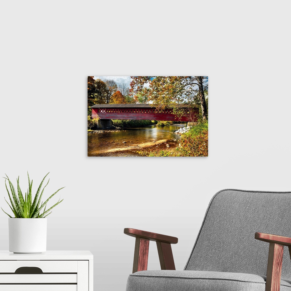 A modern room featuring Fine art photo of a historic covered bridge over the Waloomsac River in New England.