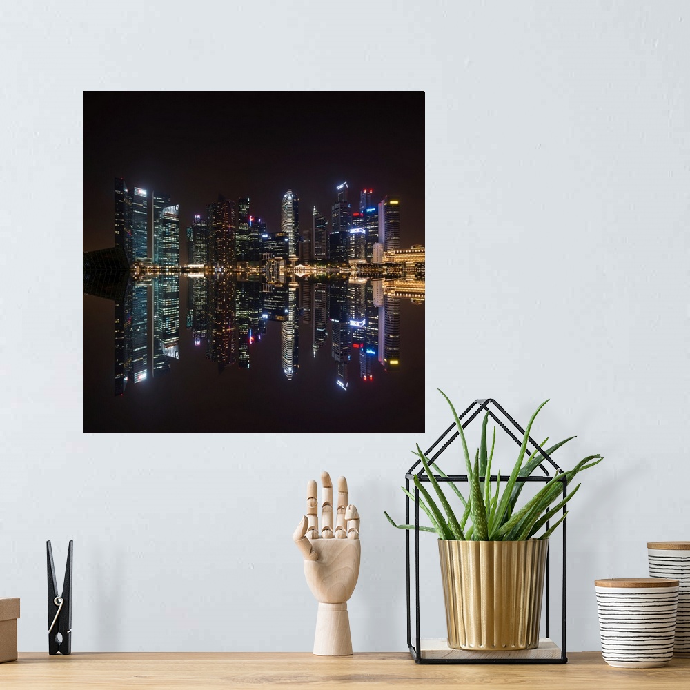 A bohemian room featuring Fine art photograph of the Singapore skyline reflected in the bay at night.