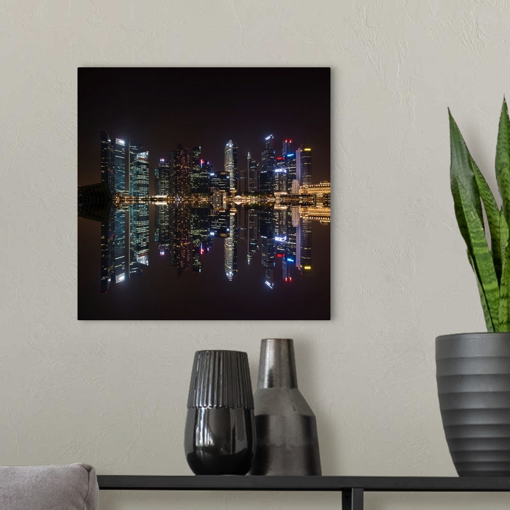 A modern room featuring Fine art photograph of the Singapore skyline reflected in the bay at night.