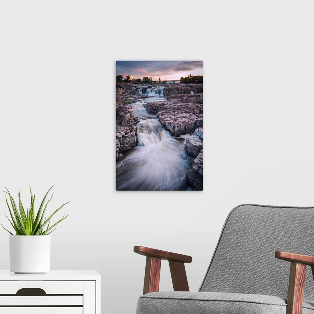 A modern room featuring Cascading waterfall in Sioux Falls South Dakota during sunset.