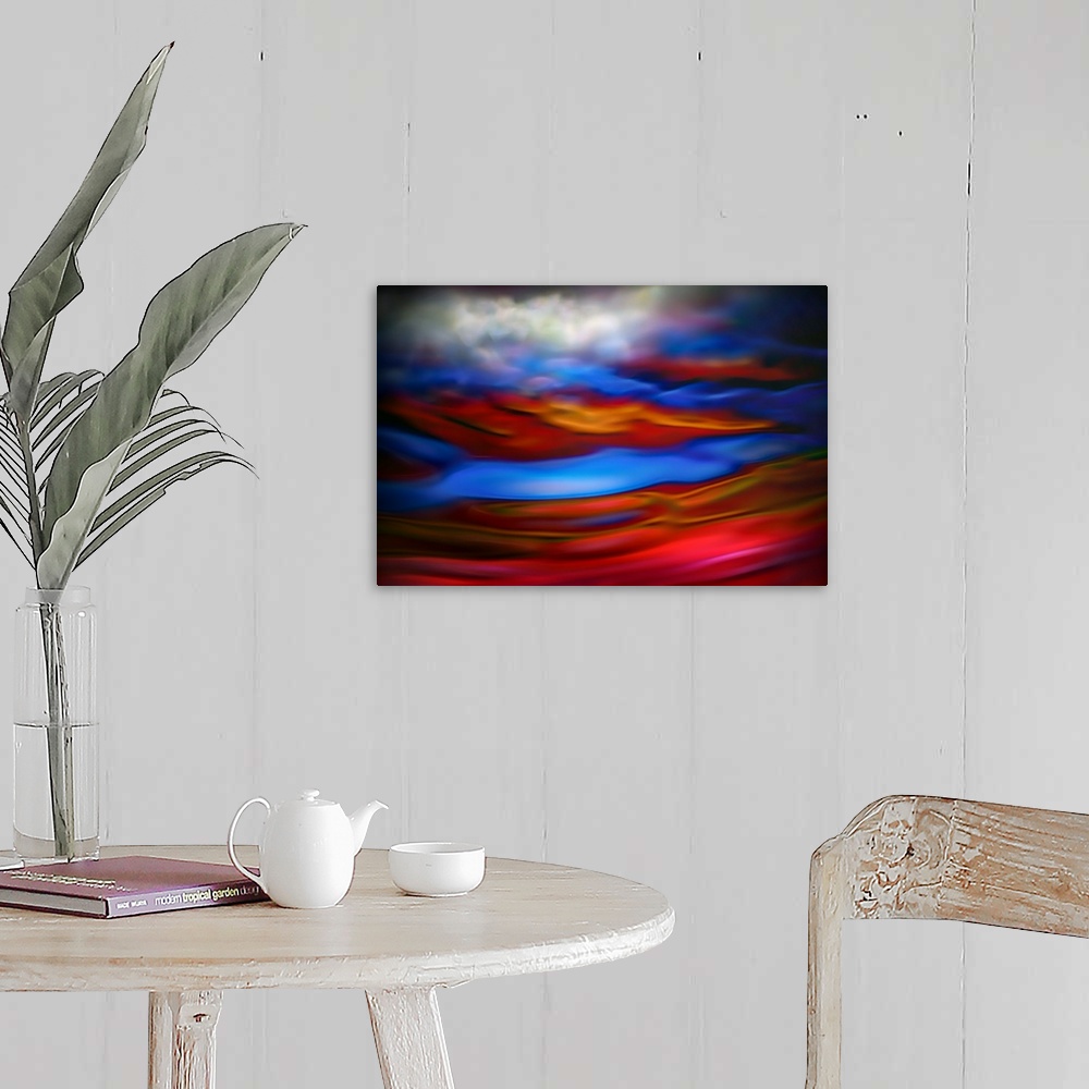 A farmhouse room featuring Abstract photograph in red and blue shades resembling ocean waves.