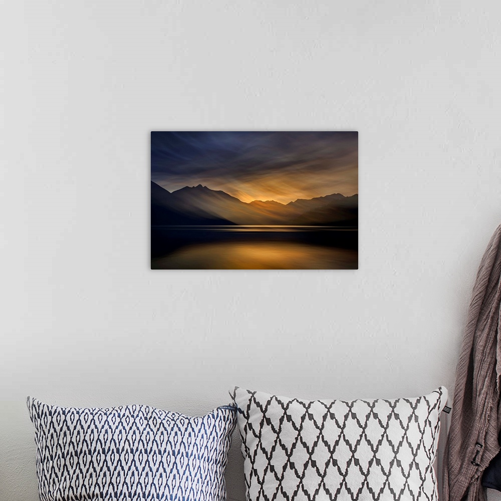 A bohemian room featuring Artistic abstract photograph of a serene lake and mountain scene.