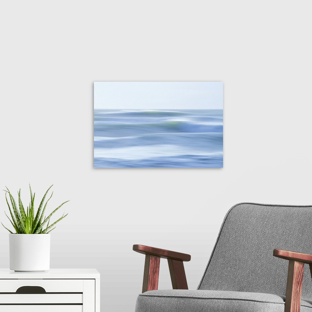 A modern room featuring Waves dancing in the light of the setting wintersun.