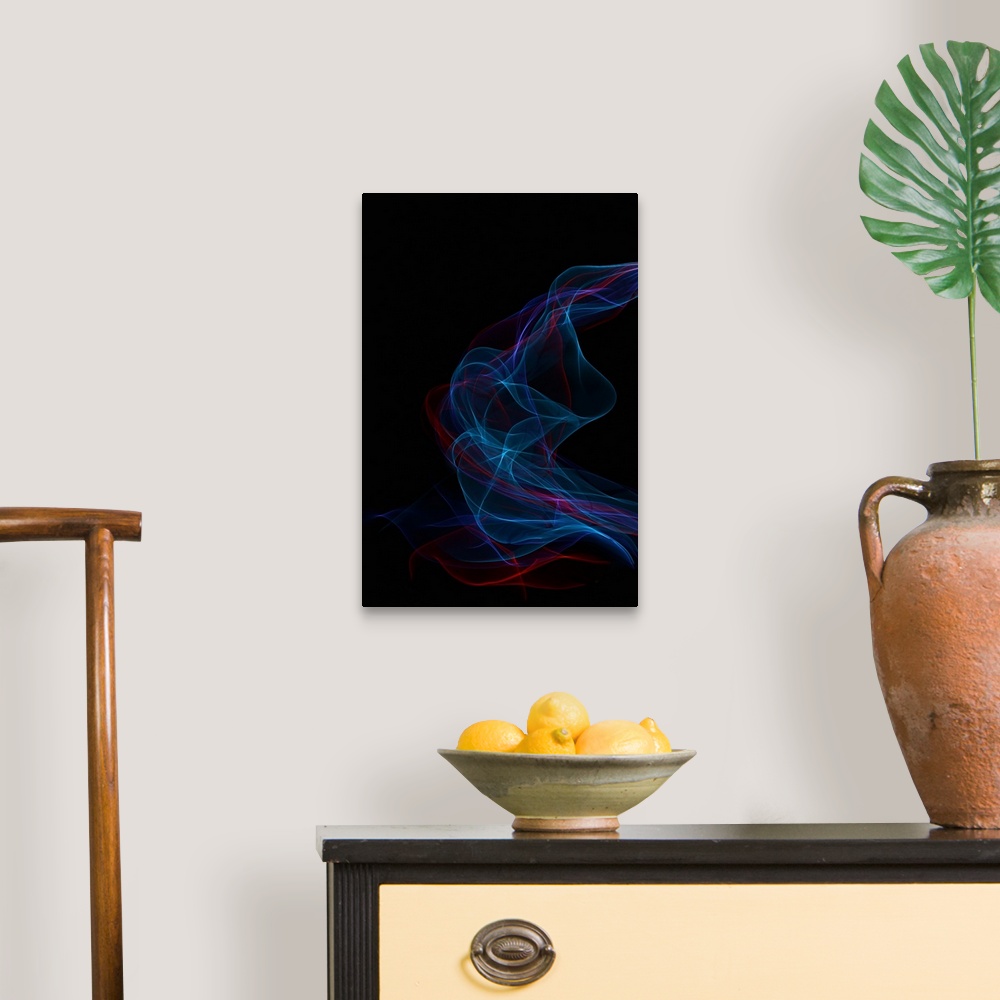 A traditional room featuring Abstract image created by trailing blue and red lights, resembling wisps of smoke.