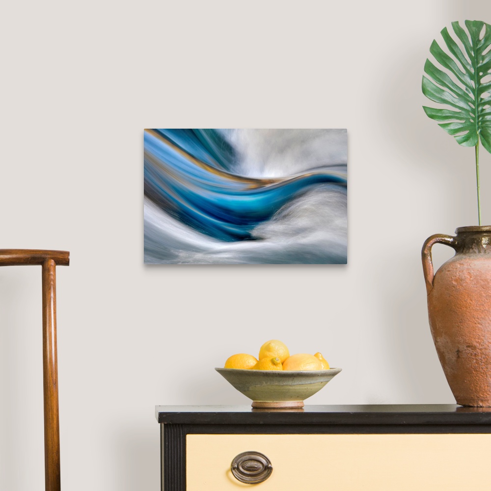 A traditional room featuring Abstract painting in which cool and warm tones flow from left to right while white rushes from th...
