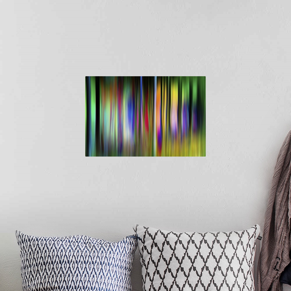 A bohemian room featuring Abstract image of colorful vertical bands resembling neon trees.