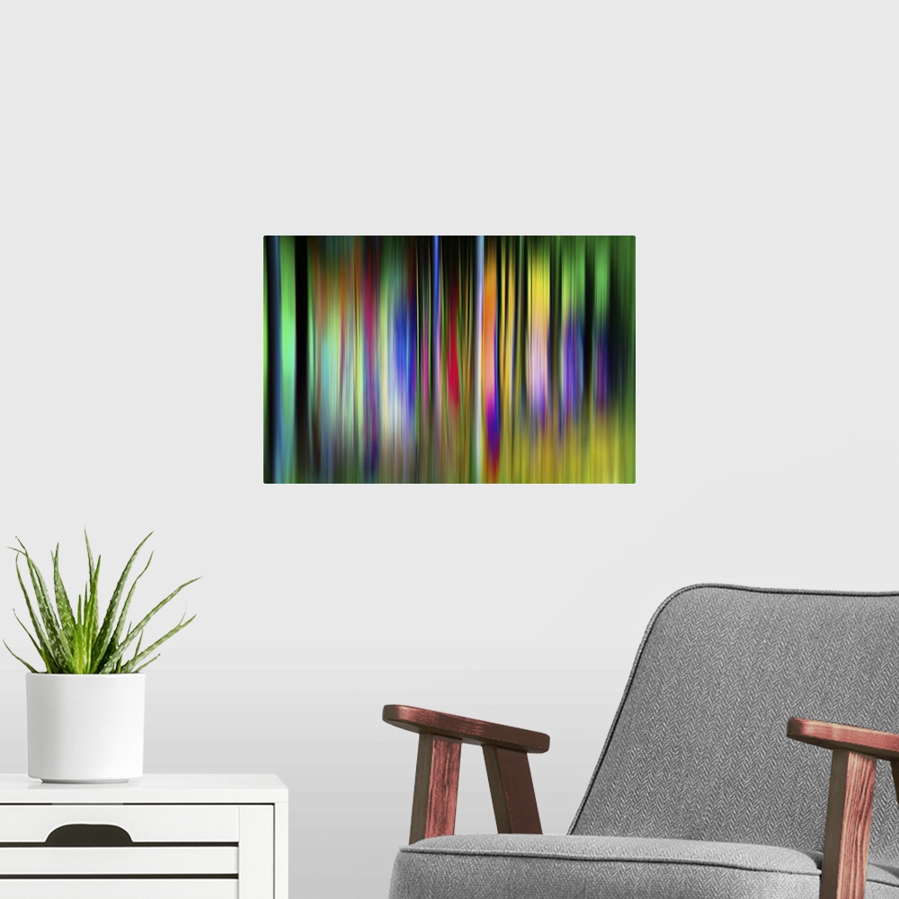 A modern room featuring Abstract image of colorful vertical bands resembling neon trees.