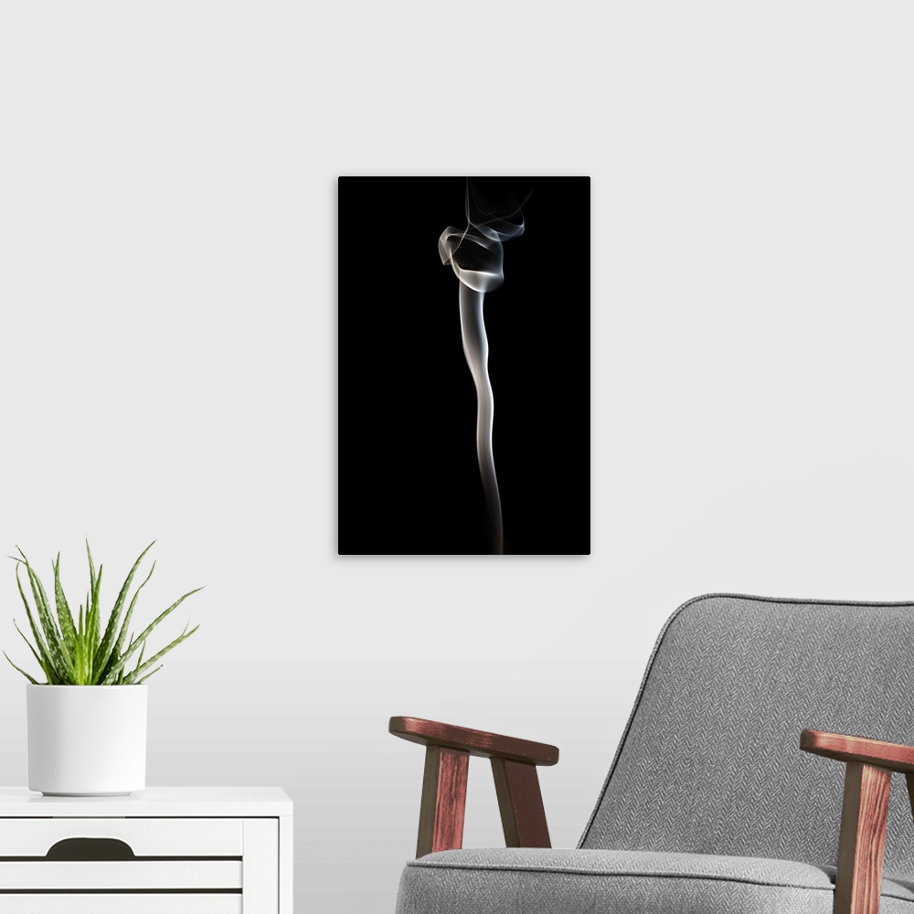 A modern room featuring White smoke rising on a black background.