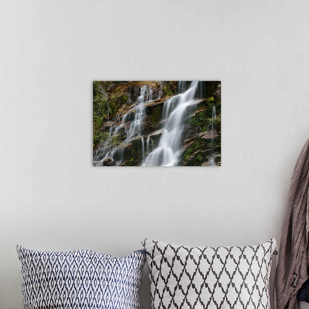 A bohemian room featuring Giant horizontal photograph of small streams of water falling and flowing over a steeply sloped r...