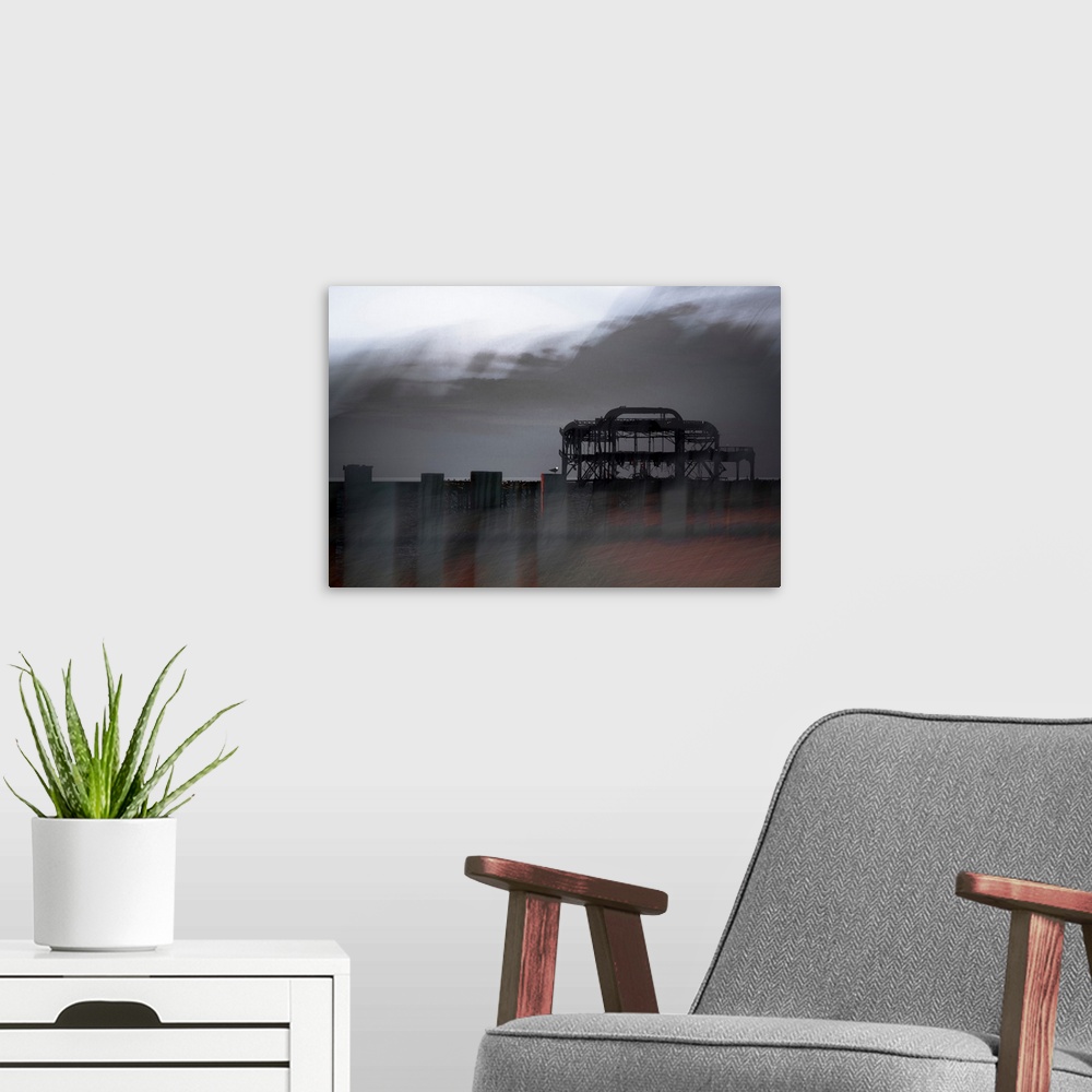 A modern room featuring A textured photo of an oil rig that has been edited to a distressed effect.