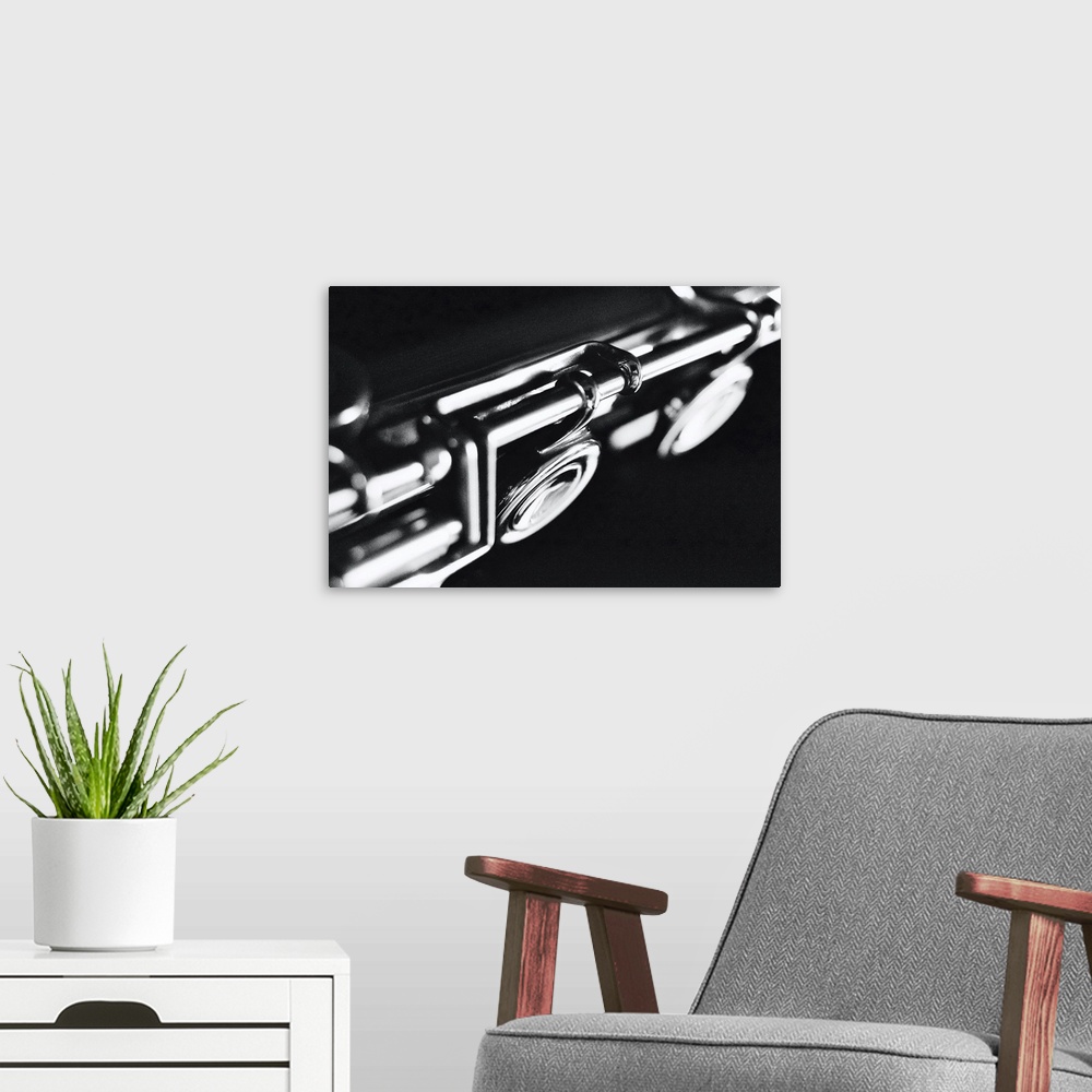 A modern room featuring An old, silver transverse flute in the leading role. Solo for a silver flute.