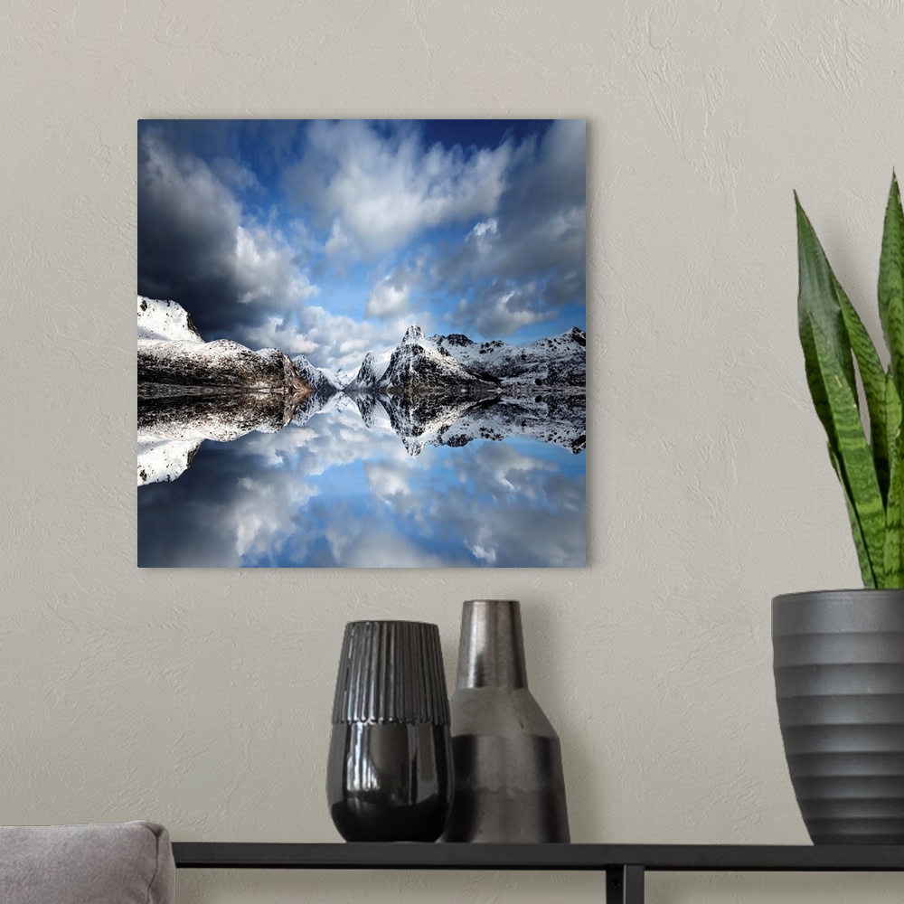 A modern room featuring Photograph of a lake casting a mirror reflection of mountains and clouds.